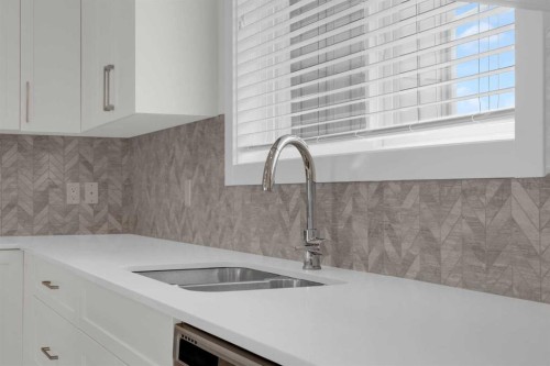 59 D'Arcy Boulevard, Okotoks, AB - Indoor Photo Showing Kitchen With Double Sink