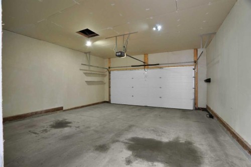 59 D'Arcy Boulevard, Okotoks, AB - Indoor Photo Showing Garage