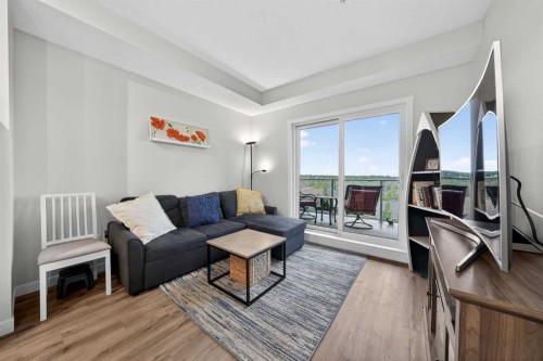 403-71 Shawnee Common Sw, Calgary, AB - Indoor Photo Showing Living Room