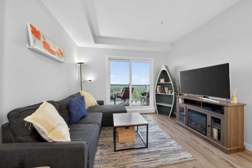 403-71 Shawnee Common Sw, Calgary, AB - Indoor Photo Showing Living Room