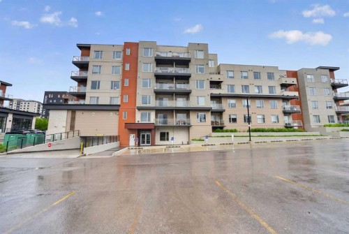 403-71 Shawnee Common Sw, Calgary, AB - Outdoor With Balcony With Facade