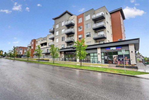 403-71 Shawnee Common Sw, Calgary, AB - Outdoor With Balcony With Facade