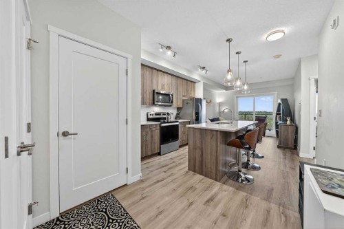 403-71 Shawnee Common Sw, Calgary, AB - Indoor Photo Showing Kitchen With Upgraded Kitchen