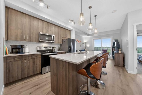 403-71 Shawnee Common Sw, Calgary, AB - Indoor Photo Showing Kitchen With Upgraded Kitchen