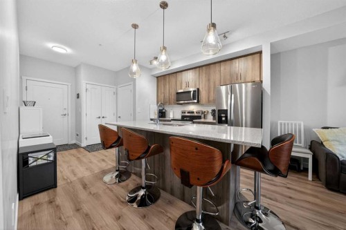 403-71 Shawnee Common Sw, Calgary, AB - Indoor Photo Showing Kitchen With Upgraded Kitchen