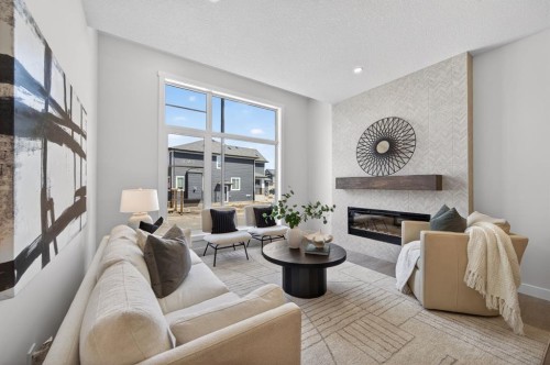 1059 Bayview Crescent, Airdrie, AB - Indoor Photo Showing Living Room With Fireplace