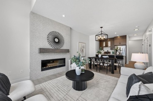 1059 Bayview Crescent, Airdrie, AB - Indoor Photo Showing Living Room With Fireplace