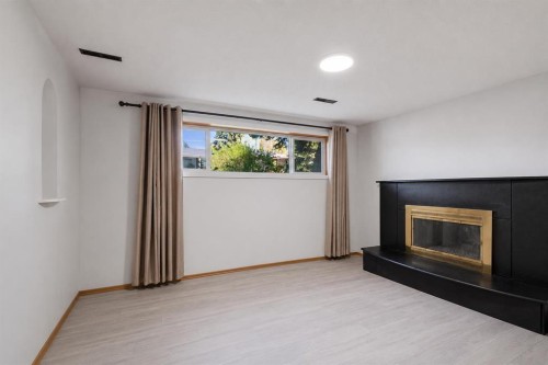 5724 Dalmead Crescent Nw, Calgary, AB - Indoor Photo Showing Living Room With Fireplace
