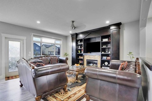 265 Saddlelake Drive Ne, Calgary, AB - Indoor Photo Showing Living Room With Fireplace