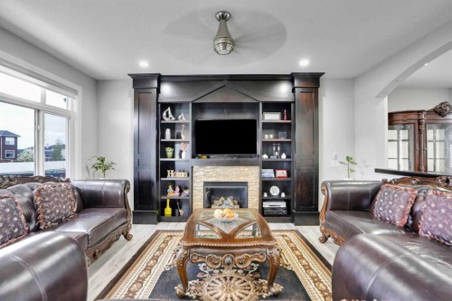 265 Saddlelake Drive Ne, Calgary, AB - Indoor Photo Showing Living Room With Fireplace