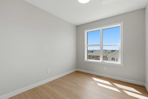 81 Wild Rose Way Se, Calgary, AB - Indoor Photo Showing Other Room