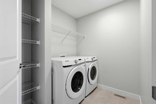 81 Wild Rose Way Se, Calgary, AB - Indoor Photo Showing Laundry Room