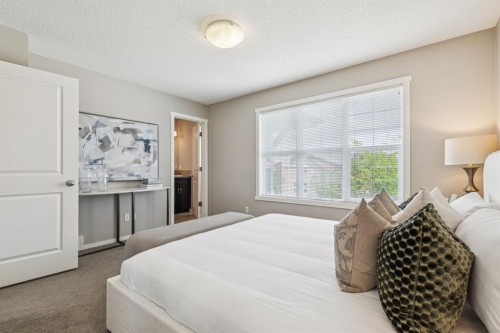 73 Marine Drive Se, Calgary, AB - Indoor Photo Showing Bedroom