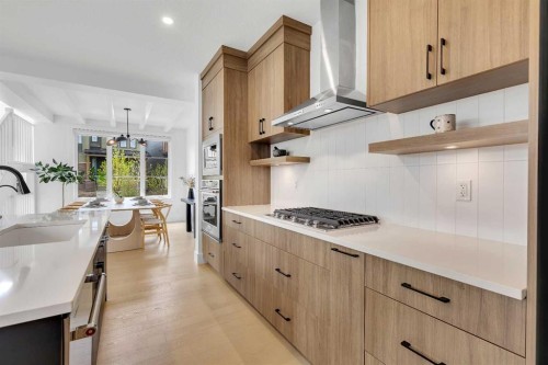 24 Alpine Common Sw, Calgary, AB - Indoor Photo Showing Kitchen With Upgraded Kitchen