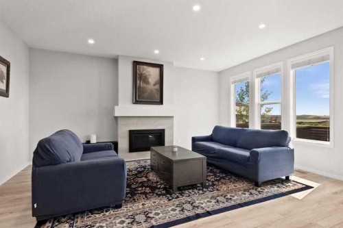 1107 Copperfield Boulevard Se, Calgary, AB - Indoor Photo Showing Living Room With Fireplace