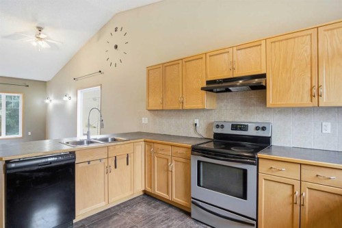 B-4810 47 Street, Olds, AB - Indoor Photo Showing Kitchen With Double Sink
