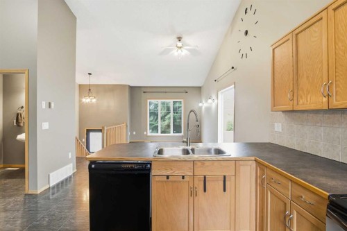 B-4810 47 Street, Olds, AB - Indoor Photo Showing Kitchen With Double Sink