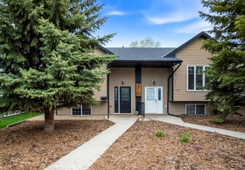 B-4810 47 Street, Olds, AB - Outdoor With Deck Patio Veranda With Facade
