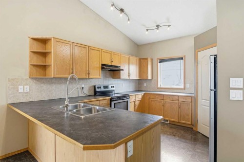 B-4810 47 Street, Olds, AB - Indoor Photo Showing Kitchen With Double Sink