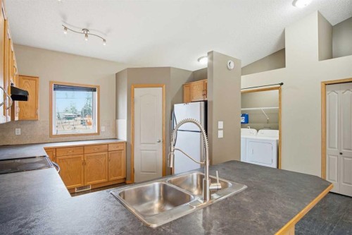 B-4810 47 Street, Olds, AB - Indoor Photo Showing Kitchen With Double Sink