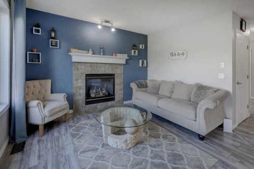 316 Ranch Garden, Strathmore, AB - Indoor Photo Showing Living Room With Fireplace