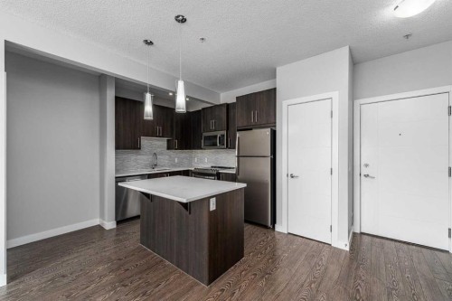 205-12 Sage Hill Terrace Nw, Calgary, AB - Indoor Photo Showing Kitchen With Stainless Steel Kitchen
