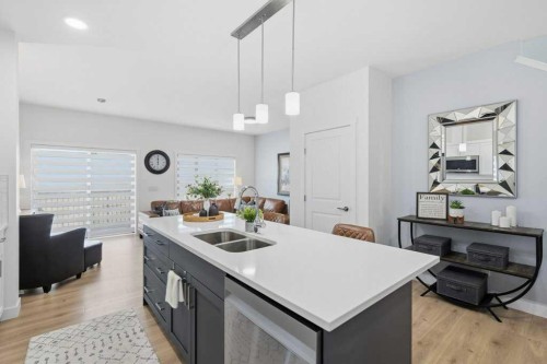 55 Heritage Manor, Cochrane, AB - Indoor Photo Showing Kitchen With Double Sink With Upgraded Kitchen