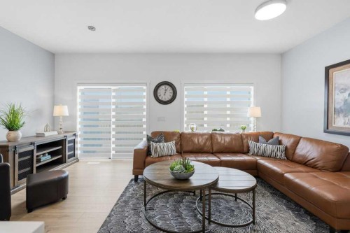 55 Heritage Manor, Cochrane, AB - Indoor Photo Showing Living Room