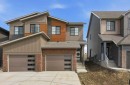 55 Heritage Manor, Cochrane, AB  - Outdoor With Facade 