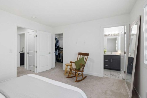 55 Heritage Manor, Cochrane, AB - Indoor Photo Showing Bedroom