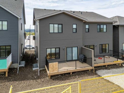 55 Heritage Manor, Cochrane, AB - Outdoor With Deck Patio Veranda