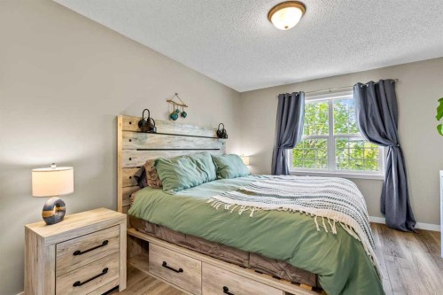 65 Prestwick Heights Se, Calgary, AB - Indoor Photo Showing Bedroom