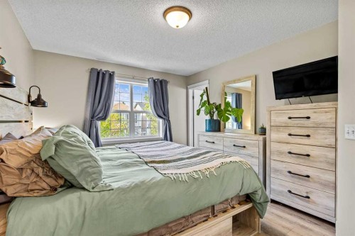 65 Prestwick Heights Se, Calgary, AB - Indoor Photo Showing Bedroom
