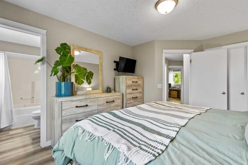 65 Prestwick Heights Se, Calgary, AB - Indoor Photo Showing Bedroom