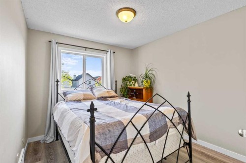 65 Prestwick Heights Se, Calgary, AB - Indoor Photo Showing Bedroom