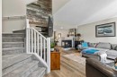 65 Prestwick Heights Se, Calgary, AB  - Indoor Photo Showing Living Room With Fireplace 