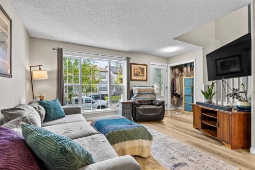 65 Prestwick Heights Se, Calgary, AB - Indoor Photo Showing Living Room