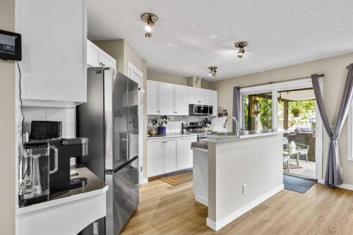 65 Prestwick Heights Se, Calgary, AB - Indoor Photo Showing Kitchen With Stainless Steel Kitchen