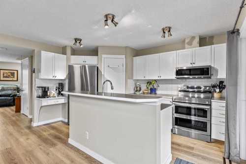 65 Prestwick Heights Se, Calgary, AB - Indoor Photo Showing Kitchen With Stainless Steel Kitchen With Upgraded Kitchen