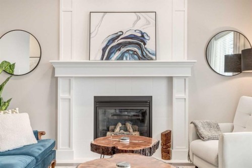 335 Morningside Crescent Sw, Airdrie, AB - Indoor Photo Showing Living Room With Fireplace