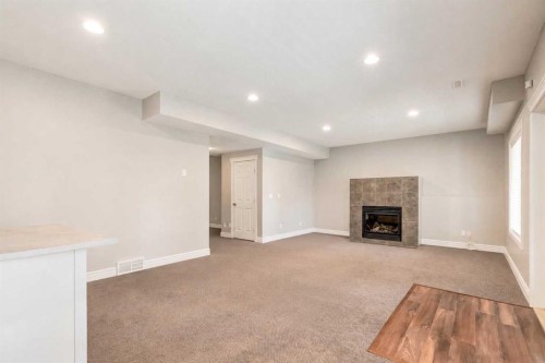 335 Morningside Crescent Sw, Airdrie, AB - Indoor With Fireplace