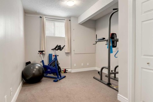 335 Morningside Crescent Sw, Airdrie, AB - Indoor Photo Showing Gym Room