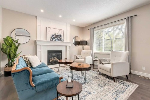 335 Morningside Crescent Sw, Airdrie, AB - Indoor Photo Showing Living Room With Fireplace