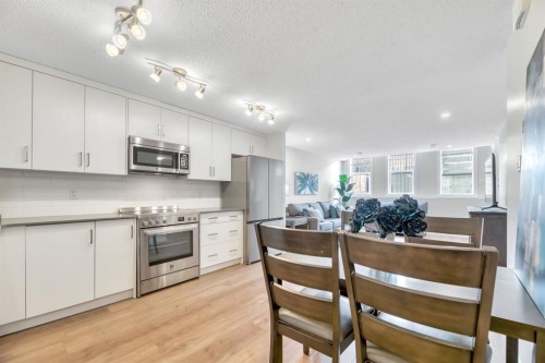 314 Cranbrook Square Se, Calgary, AB - Indoor Photo Showing Kitchen With Upgraded Kitchen