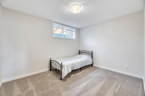 314 Cranbrook Square Se, Calgary, AB - Indoor Photo Showing Bedroom