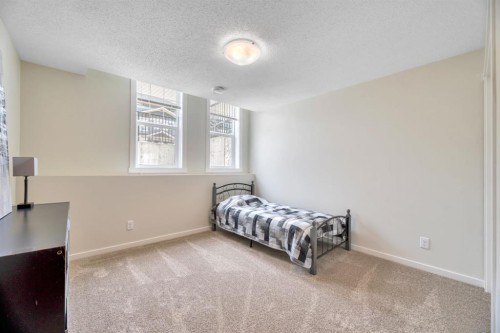 314 Cranbrook Square Se, Calgary, AB - Indoor Photo Showing Bedroom