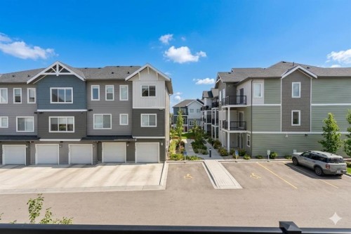 1701-24 Rivercrest Drive, Cochrane, AB - Outdoor With Facade