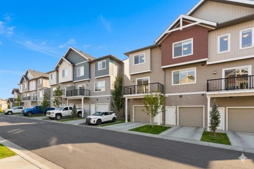 1701-24 Rivercrest Drive, Cochrane, AB - Outdoor With Facade