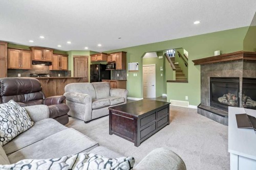 158 New Brighton Lane Se, Calgary, AB - Indoor Photo Showing Living Room With Fireplace