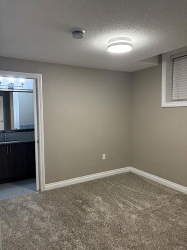 25 Redstone Path Ne, Calgary, AB - Indoor Photo Showing Other Room